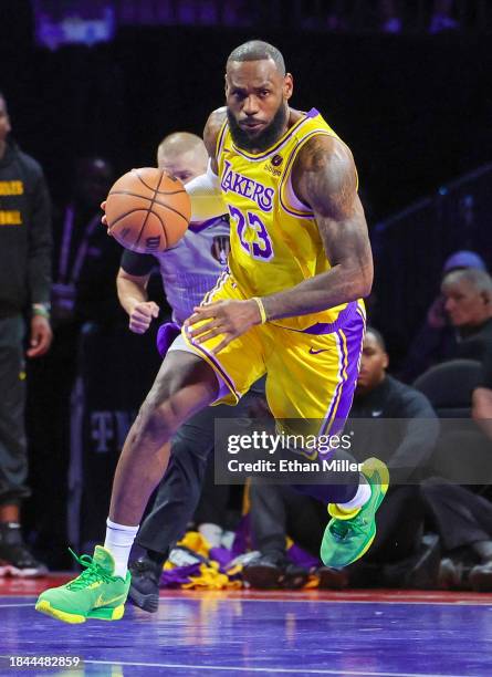 LeBron James of the Los Angeles Lakers brings the ball up the court against the Indiana Pacers in the first quarter of the championship game of the...