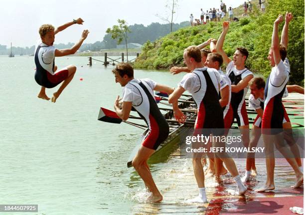Alexey Salamini, , the coxswain of the USA Men's Lightweight Eight rowing team, gets thrown in the Martindale pond by the rowers after winning the...