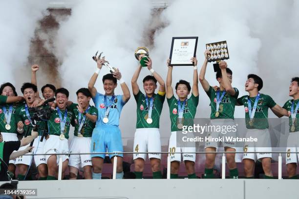 Players of Aomori Yamada celebrate with the trophy after the Prince Takamado Trophy JFA U-18 Football Premier League final between Aomori Yamada and...