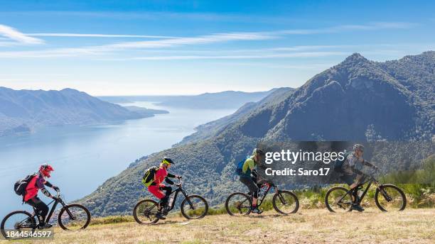 lake maggiore mountain biking. - lombard stock pictures, royalty-free photos & images