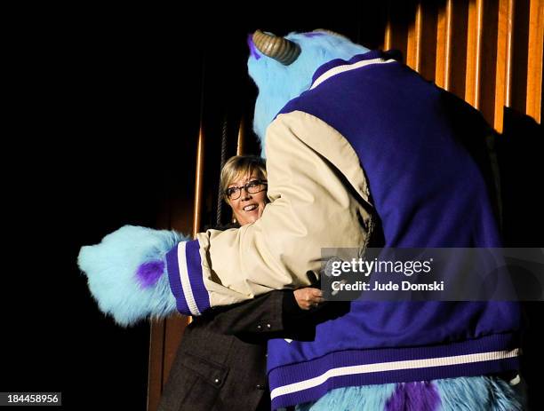 Pixar character James P. Sullivan from the animated films "Monsters, Inc" and "Monsters University" with Pixar Producer Kori Rae on stage at Hopkins...