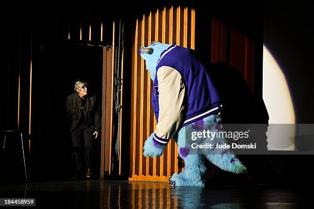 Pixar character James P. Sullivan from the animated films "Monsters, Inc" and "Monsters University" with Pixar Producer Kori Rae on stage at Hopkins...