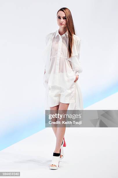 Model showcases designs on the runway during the Yasutoshi Ezumi show as part of Mercedes Benz Fashion Week Tokyo S/S 2014 at Hikarie Hall B of...