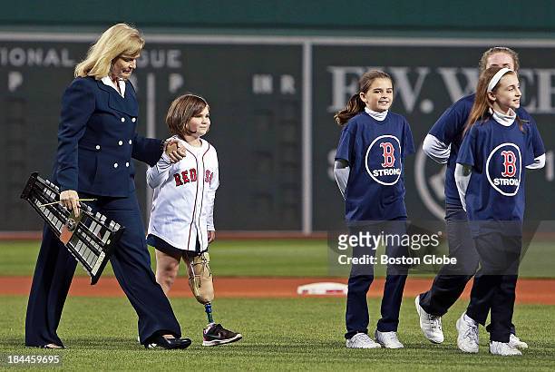 Before the game, the national anthem was sung by a group of children from St. Ann's Parish in Dorchester, which included Jane Richard, second from...