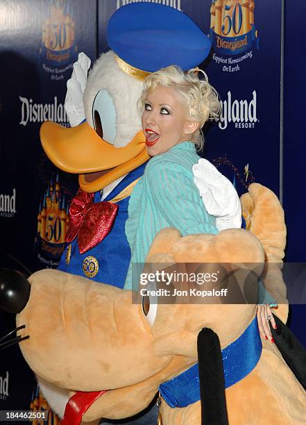 Christina Aguilera with Donald Duck and Pluto during Disneyland 50th Anniversary "Happiest Homecoming on Earth" Celebration - Arrivals and Fireworks...