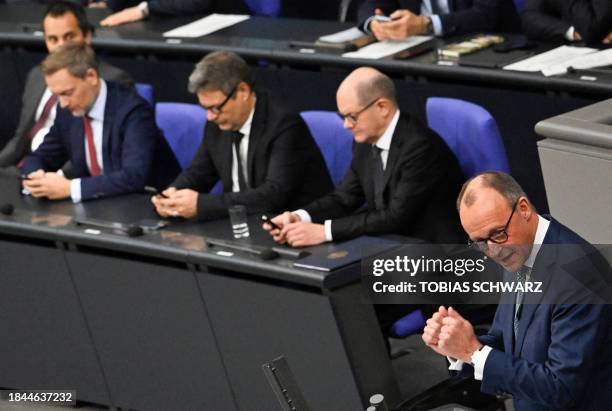 Leader of Germany's Christian Democratic Union CDU Friedrich Merz addresses delegates in front of German Finance Minister Christian Lindner , German...