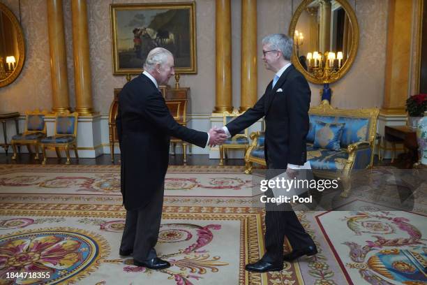 The Ambassador of Sweden, Stefan Gullgren, presents his credentials to King Charles III during a private audience at Buckingham Palace on December...