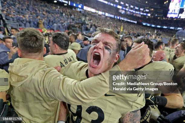 Foxboro, MA- Army Black Knights defensive lineman Cody Winokur screams after the win as Army takes on Navy at Gillette on December 9.