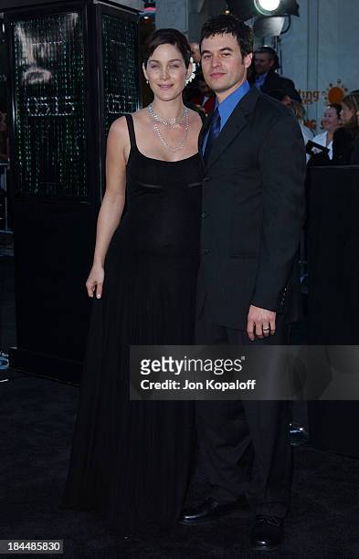 Carrie Anne Moss & husband Steven Roy during "The Matrix Reloaded" Premiere - Arrivals at The Mann Village Theater in Westwood, California, United...