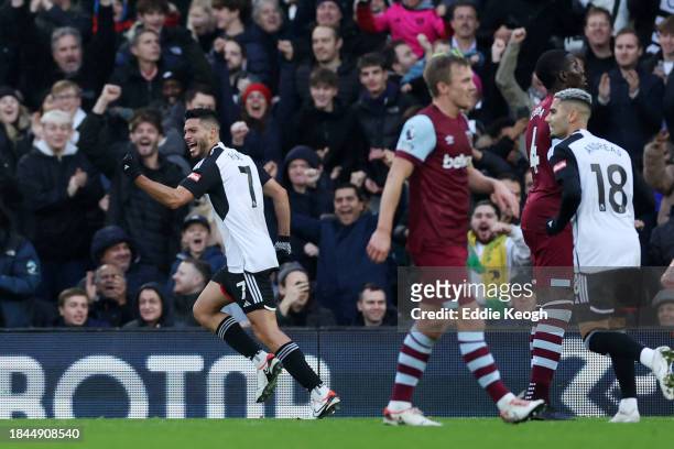 Raul Jimenez of Fulham celebrates after scoring their team's first goal during the Premier League match between Fulham FC and West Ham United at...