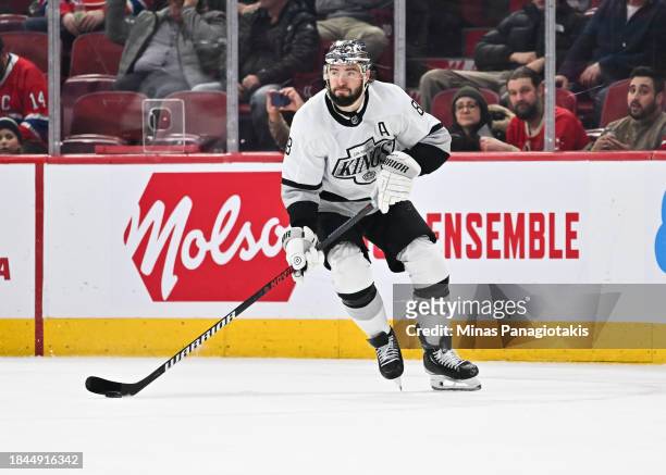 Drew Doughty of the Los Angeles Kings skates the puck during the third period against the Montreal Canadiens at the Bell Centre on December 7, 2023...