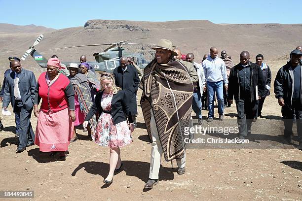 Of Sentebale Cathy Ferrier walks with his Majesty King Letsie III of Lesotho as he arrives for the opening ceremony of the new Sentebale Mateanong...