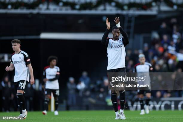Tosin Adarabioyo of Fulham celebrates scoring their team's third goal during the Premier League match between Fulham FC and West Ham United at Craven...
