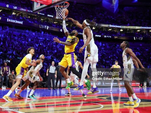 LeBron James of the Los Angeles Lakers shoots against Myles Turner of the Indiana Pacers in the second quarter of the championship game of the...