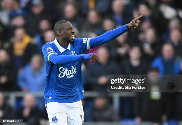 Abdoulaye Doucoure of Everton celebrates after scoring their team's first goal during the Premier League match between Everton FC and Chelsea FC at...