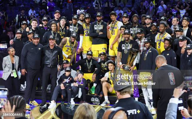 The Los Angeles Lakers pose as they celebrate their 123-109 victory over the Indiana Pacers to win the championship game of the inaugural NBA...