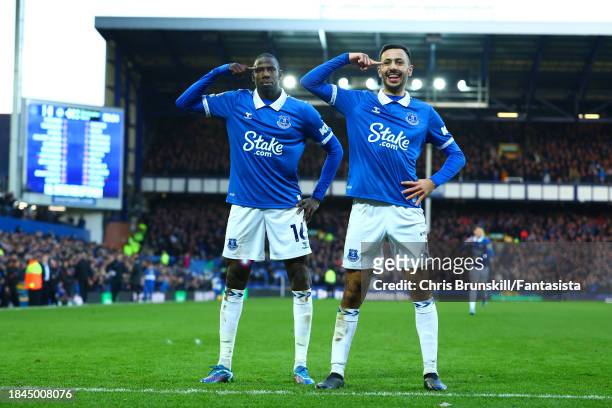 Abdoulaye Doucoure of Everton celebrates scoring the opening goal with team-mate Dwight McNeilduring the Premier League match between Everton FC and...