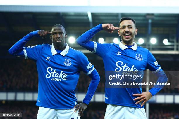 Abdoulaye Doucoure of Everton celebrates scoring the opening goal with team-mate Dwight McNeil during the Premier League match between Everton FC and...