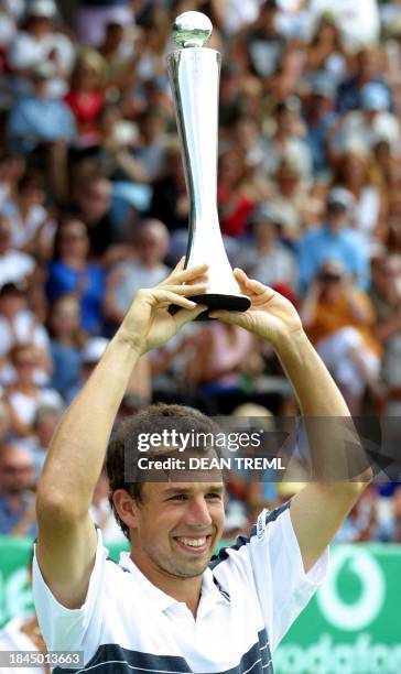 Dominik Hrbaty of Slovakia celebrates with the trophy after winning his final singles match against Rafael Nadal of Spain on the final day of the...