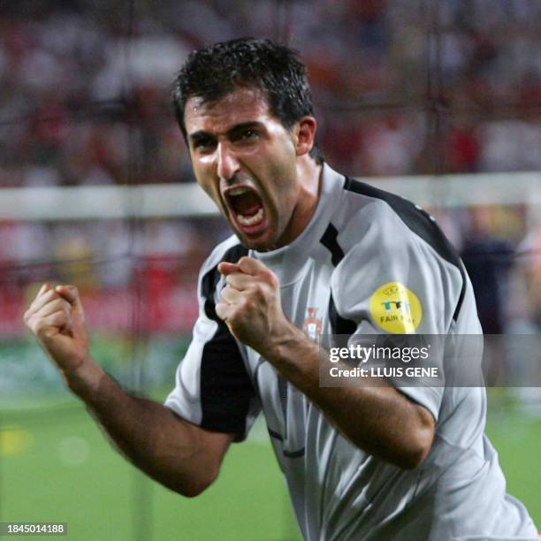 Portugal's goalkeeper Ricardo celebrates after scoring the winning penalty, 24 June 2004 during their European Nations Championship quarter-final...