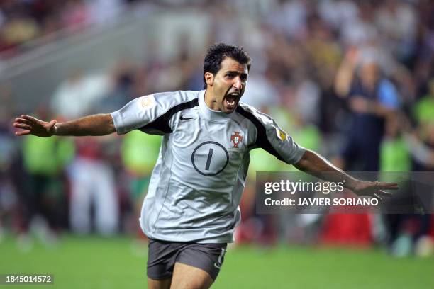 Portugal's goalkeeper Ricardo celebrates after scoring the winning penalty, 24 June 2004 during their European Nations Championship quarter-final...