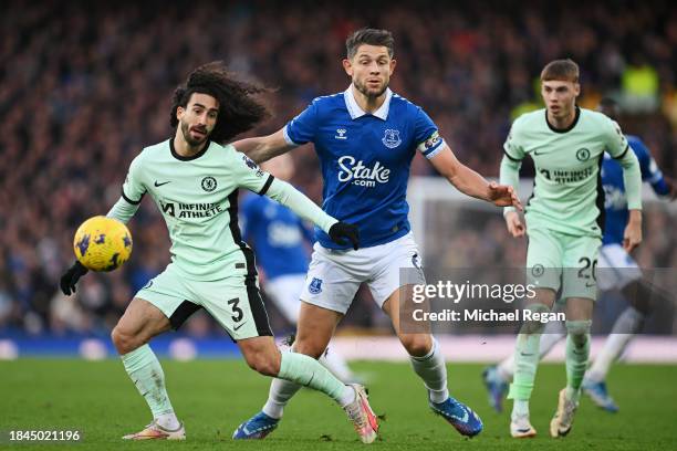 Marc Cucurella of Chelsea and James Tarkowski of Everton battle for possession during the Premier League match between Everton FC and Chelsea FC at...