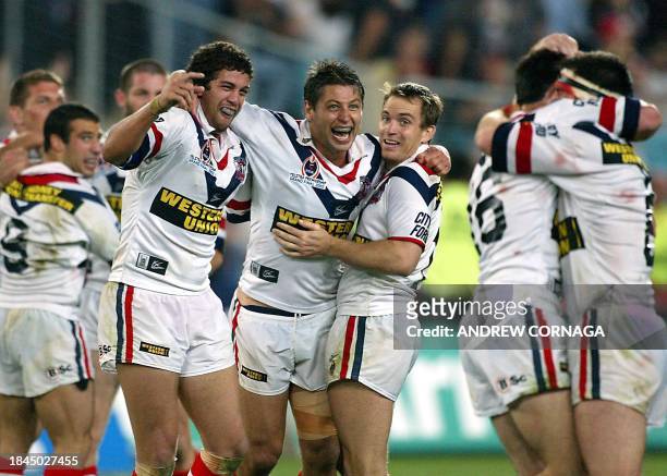 Sydney City Roosters, Jason Cayless, Luke Ricketson and Luke Phillips celebrate their victory 30-8 over the New Zealand Warriors in the NRL Grand...