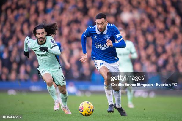 Dwight McNeil of Everton runs with the ball during the Premier League match between Everton FC and Chelsea FC at Goodison Park on December 10, 2023...
