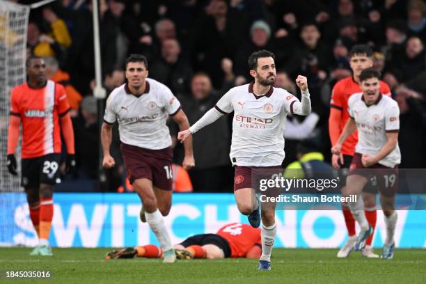 Bernardo Silva of Manchester City celebrates after scoring their team's first goal during the Premier League match between Luton Town and Manchester...