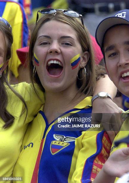 An ecuadorian fan celebrates the soccer team's victory in Quito 07 November 2001. Una hincha ecuatoriana festeja la clasificacion de Ecuador al...