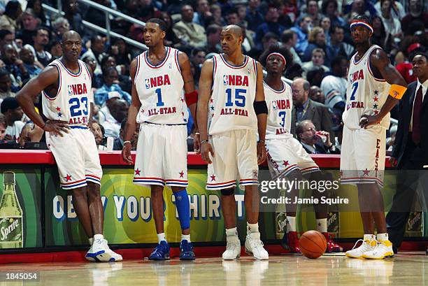 Michael Jordan, Tracy McGrady, Vince Carter, Ben Wallace and Jermaine O'Neal of the Eastern Conference All-Stars look on at the 2003 NBA All-Star...