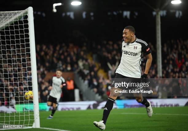 Carlos Vinicius of Fulham celebrates scoring their team's fifth goal during the Premier League match between Fulham FC and West Ham United at Craven...