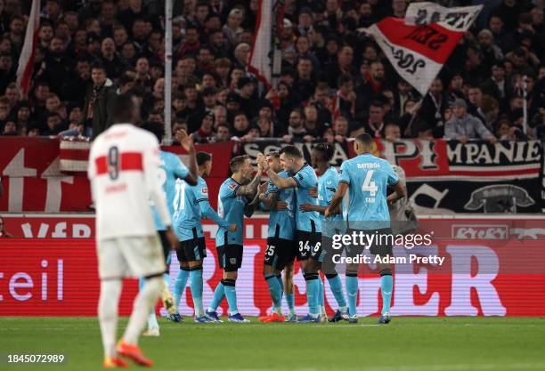 Florian Wirtz of Bayer Leverkusen celebrates with teammates after scoring their team's first goal during the Bundesliga match between VfB Stuttgart...