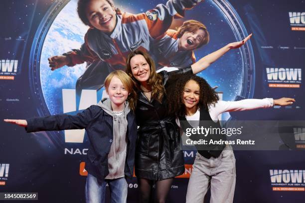 Felix Nölle, Lavinia Wilson and Ava-Elizabeth Awe attend the "Wow! Nachricht aus dem All" Premiere at Cinedom on December 10, 2023 in Cologne,...