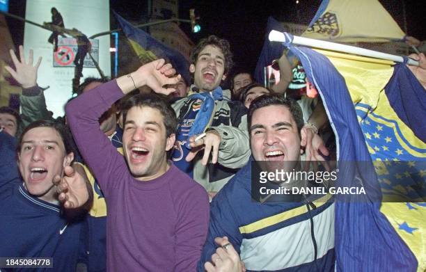 Supporters of Boca Juniors celebrate the team's victory 22 June, 2000 in Buenos Aires. Simpatizantes de Boca Juniors festejan en la madrugada del 22...