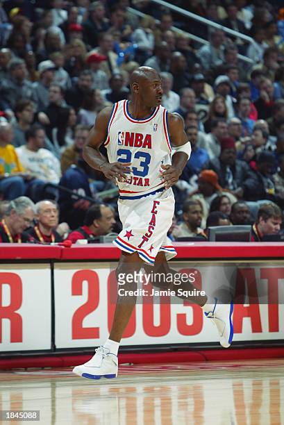 Michael Jordan and Kobe Bryant are playing in a 2003 NBA All-Star Game in  Atlanta, GA