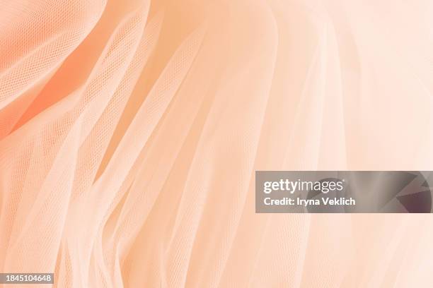 texture of gorgeous flowy tutu tuile nylon skirt in natural pastel pink beige peach color. - nylon imagens e fotografias de stock