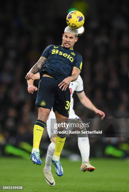 Bruno Guimaraes of Newcastle United jumps for the ball during the Premier League match between Tottenham Hotspur and Newcastle United at Tottenham...