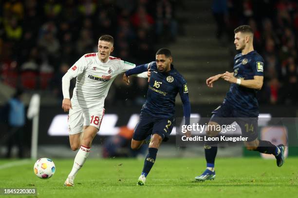 Rasmus Carstensen of 1.FC Köln is challenged by Phillipp Mwene of 1.FSV Mainz 05 during the Bundesliga match between 1. FC Köln and 1. FSV Mainz 05...