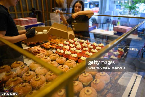 Speciality sufganiot are sold at Roladin on the fourth night of Hanukkah on December 10, 2023 in Tel Aviv, Israel. It has been more than two months...