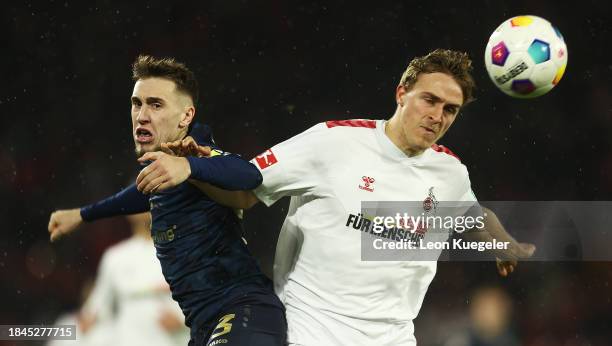 Brajan Gruda of 1.FSV Mainz 05 and Timo Huebers of 1.FC Köln battle for the ball during the Bundesliga match between 1. FC Köln and 1. FSV Mainz 05...