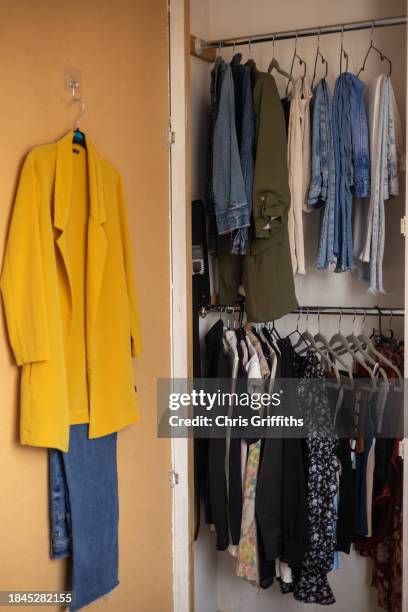 bedroom wardrobe full of womens clothing, bristol, england, united kingdom - door hanger stock pictures, royalty-free photos & images