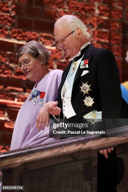 Astrid Söderbergh Widding and King Carl XVI Gustaf of Sweden attend the Nobel Prize Banquet 2023 at Stockholm City Hall on December 10, 2023 in...