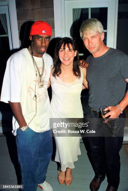 Sean "Puff Daddy" Combs at a party in the Hamptons with Bonnie Fuller and Billy Baldwin,