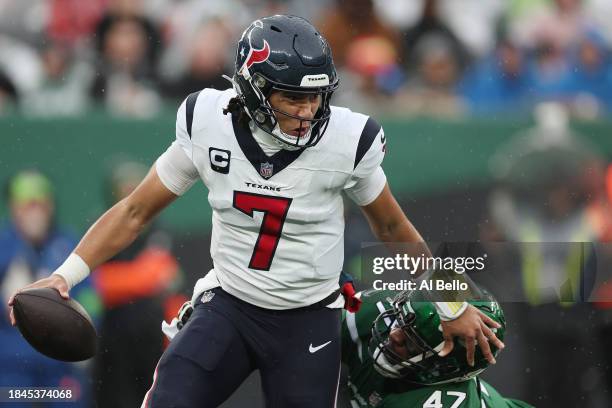 Bryce Huff of the New York Jets sacks C.J. Stroud of the Houston Texans during the first quarter at MetLife Stadium on December 10, 2023 in East...