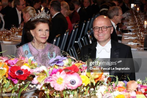 Queen Silvia of Sweden and Vidar Helgesen attend the Nobel Prize Banquet 2023 at Stockholm City Hall on December 10, 2023 in Stockholm, Sweden.