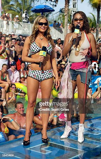 Actress Carmen Electra and MTV VJ La La appear during a taping for "MTV Spring Break 2003" at the Surfcomber Hotel March 12, 2003 in Miami Beach,...