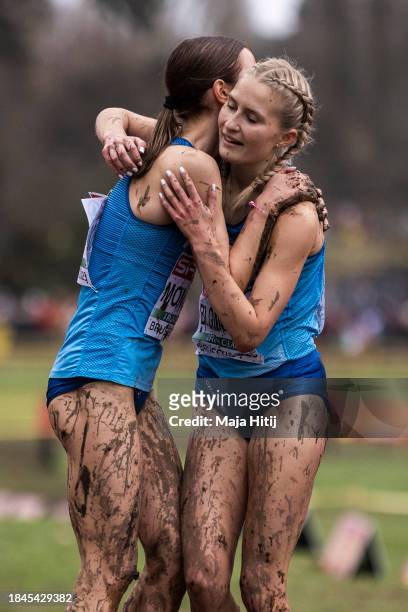 Second place finisher Ilona Mononen and third place finisher Nathalie Blomqvist of Finland celebrate after the U23 Women's race during the SPAR...