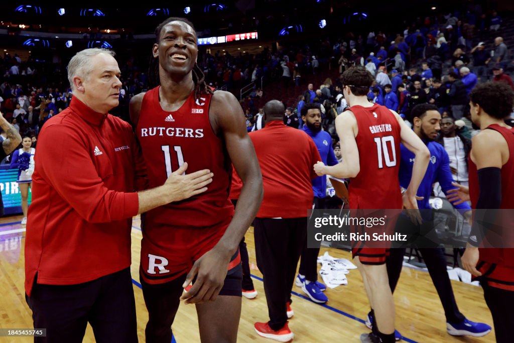 Chantaya Rutgers Head coach Steve Pikiell of the Rutgers Scarlet Knights embraces ...