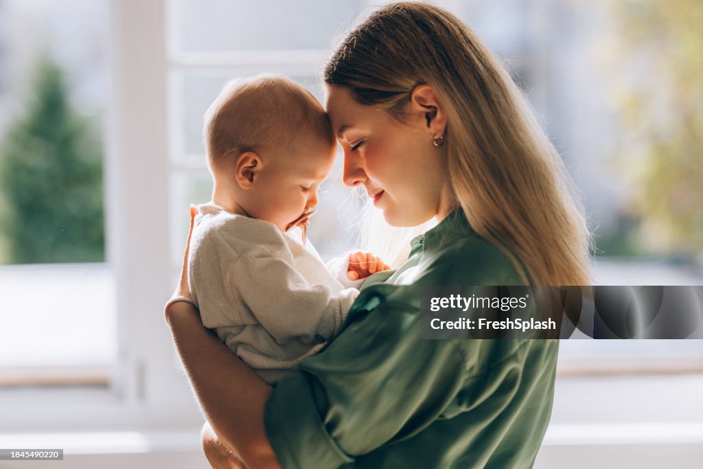 Embracing Motherhood: Mother and Baby Share a Moment of Love